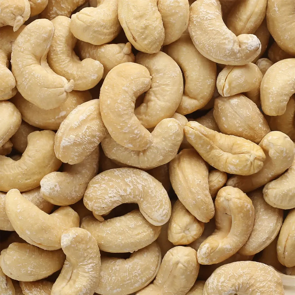 Close-up view of Jewel Farmer Plain Cashew Nuts – smooth, creamy texture with a rich, crunchy bite. Premium quality whole cashews